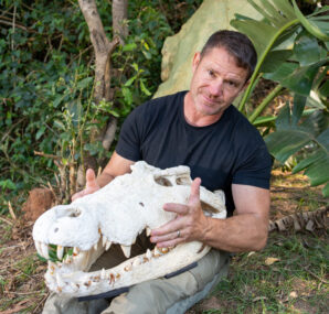 Steve Backshall holding a baby Alligator